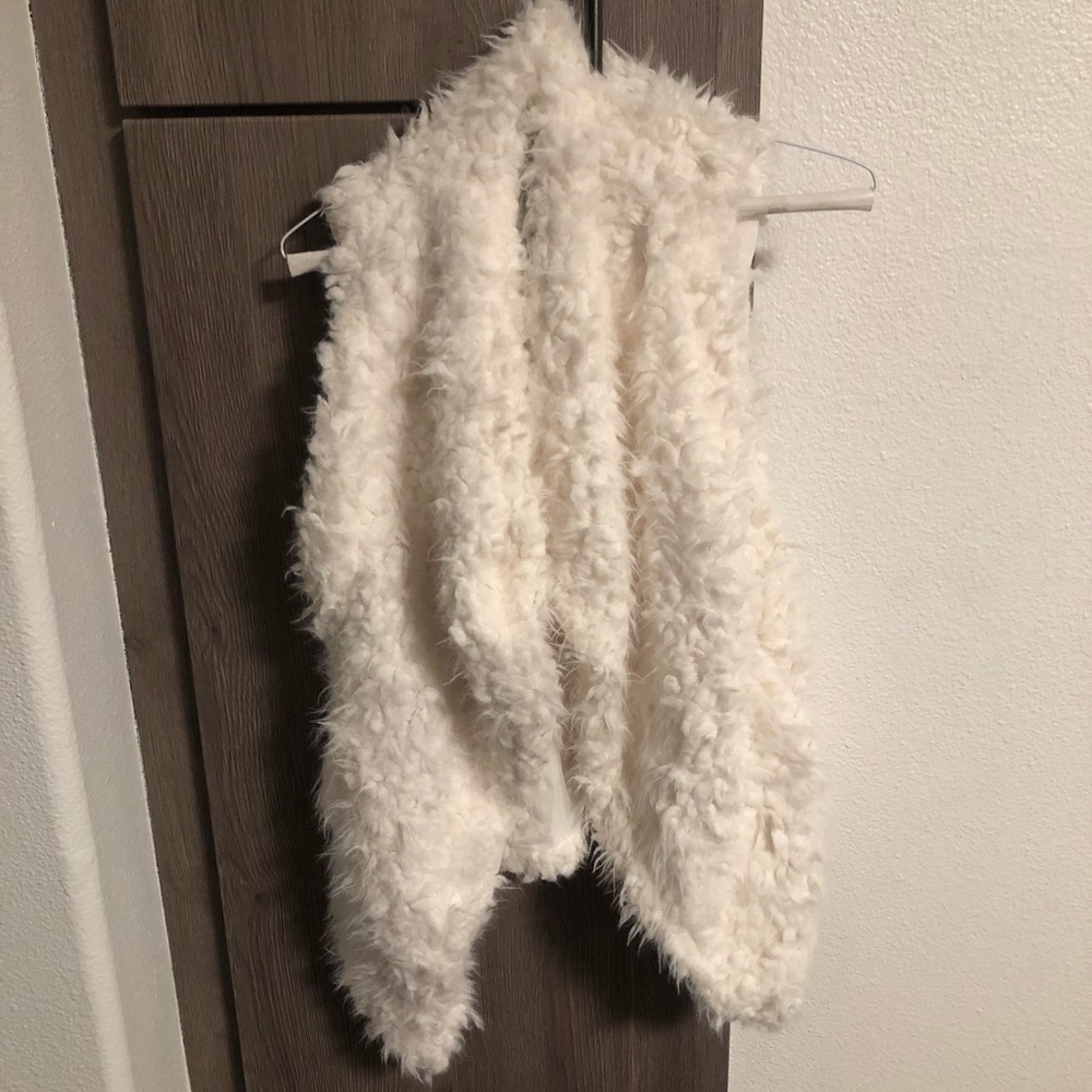 White furry vest